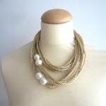 Gold and white pearls neck..