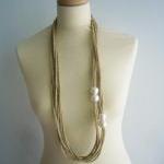  Gold and white pearls neck..