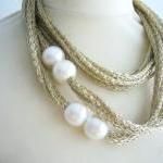  Gold and white pearls neck..