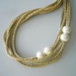  Gold and white pearls neck..
